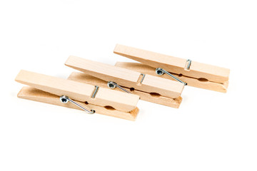Three wood clothespins isolated on white background