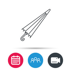 Umbrella icon. Water protection sign. Rainy weather symbol. Group of people, video cam and calendar icons. Vector
