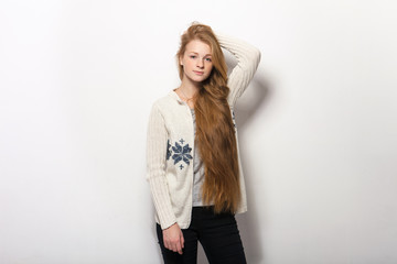 Fototapeta premium Human pose expressions and emotions. Portrait of young adorable redhead woman showing her gorgeous extra long natural red hair in cozy sweatshirt