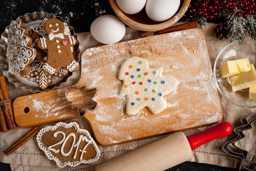 cooking christmas gingerbread on wooden background top view