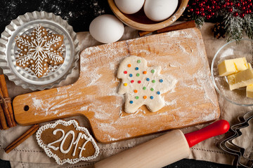 cooking christmas gingerbread on wooden background top view