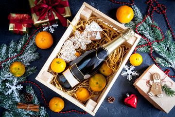 New Year's champagne and tangerines in box top view
