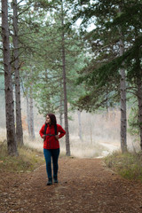 Fototapeta premium Woman hiking in the forest