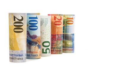 Obraz na płótnie Canvas Set of rolled swiss franc banknotes