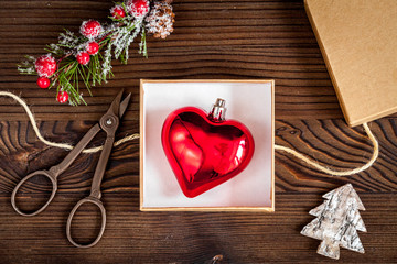 packaging christmas gifts in boxes on wooden background top view