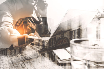 Fototapeta premium Double exposure of success businessman using stylus pen,digital