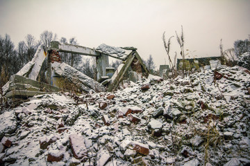 Nuclear winter.The remains of destroyed houses covered with snow