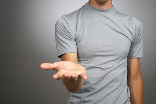 Man Holding Something On His Palm