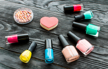 set of decorative cosmetics on wooden background top view