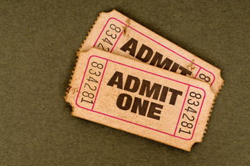 Two pair old vintage retro admit one ticket stub for movie concert theater torn damaged worn used isolated on plain brown background photo © david_franklin