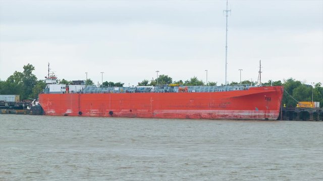 Generic Unmarked Red Chemical Tanker Cargo Ship Docked in the Mississippi River
