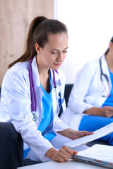 Fototapeta premium Happy medical team discussing and working together