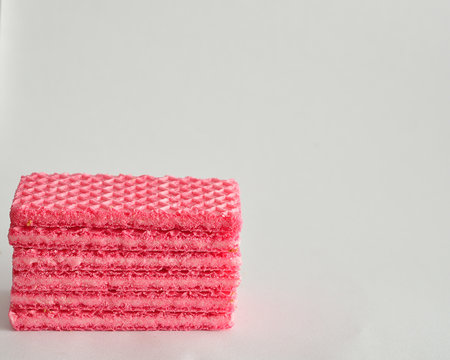 A Stack Of Pink Wafer Biscuits