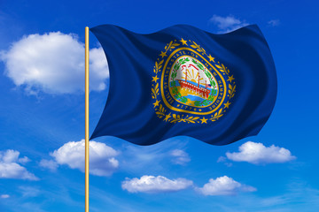 Flag of New Hampshire waving on blue sky backdrop