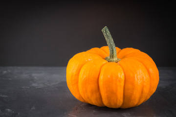 orange decorative pumpkins on a gray background