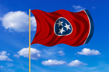 Flag of Tennessee waving on blue sky background