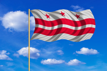 Flag of Washington, D.C. wavy on blue sky backdrop