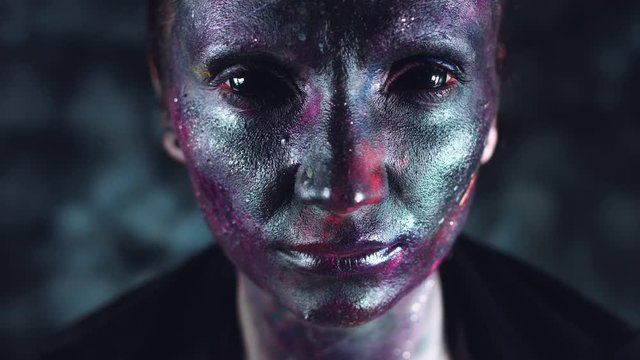 4k Cosmic Shot of a Woman with Alien make-up Opening Blackout Eyes
