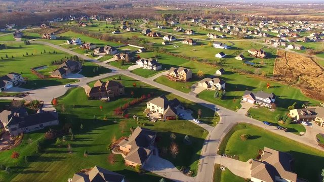 Idyllic upper class neighborhood in Autumn, early morning aerial view.
