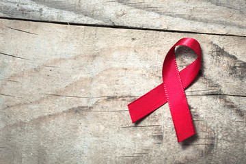 Red ribbon - symbol of awareness and support for those living with HIV