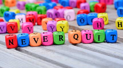 Never quit words on table