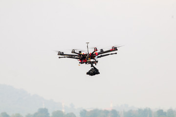 Fototapeta na wymiar drone with professional camera flying.