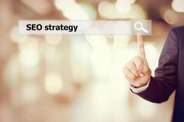 Businessman hand touch screen SEO, search engine optimization