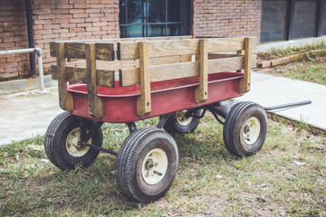 Fototapeta premium red cart with wood panel for agriculture