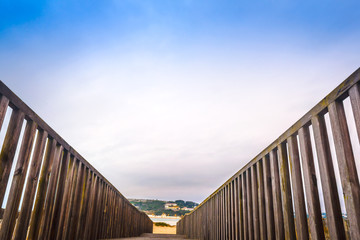 Wooden walking path at the beach. Obidos Lagoon. Portugal