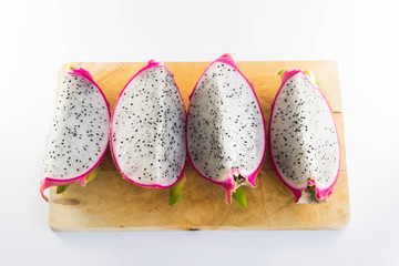 Dragon fruit on wooden chopping board