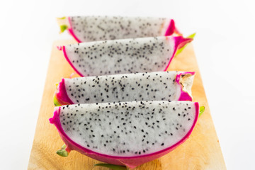 Dragon fruit on wooden chopping board