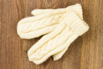 Fototapeta na wymiar white knitting mittens