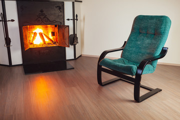 chair in front of fireplace