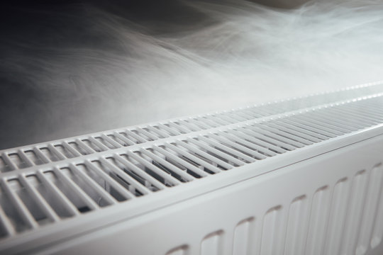 heating radiator at home with warm steam