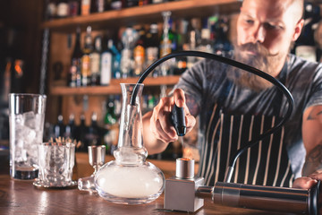 Barman is making cocktail