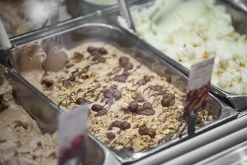 Variety of yummy ice creams under shopping window