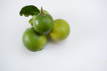 .Keep fresh lemon sour vitamin C from fresh green on a white bac