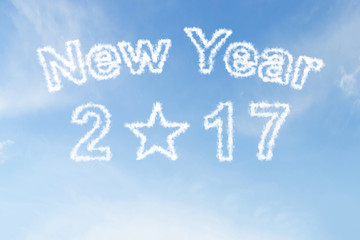 Fototapeta na wymiar Happy new year 2017 and star shape cloud on blue sky