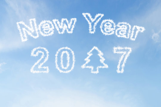 Happy new year 2017 and christmas tree cloud on blue sky