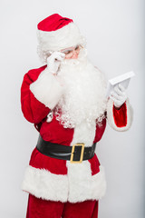 Santa Claus Reading Letter isolated over white baclground