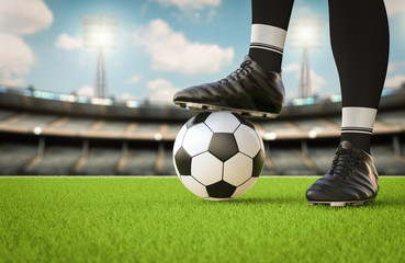 soccer player standing with soccer ball