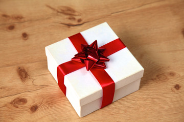 New Year gift on a golden tinsel background boly