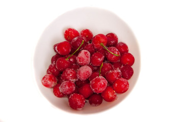 Frozen cherries on a white background.