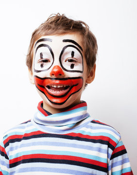 little cute boy with facepaint like clown, pantomimic expression