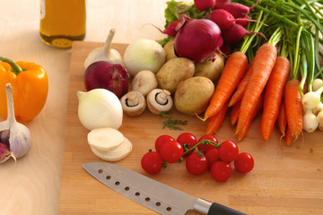Pile of organic vegetables on a wooden table