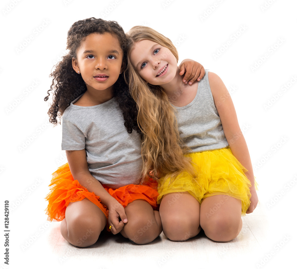 Wall mural two little girls-friends with different complexion