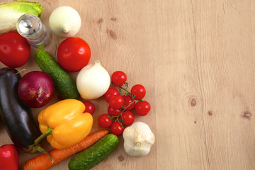 Pile of organic vegetables on a wooden table