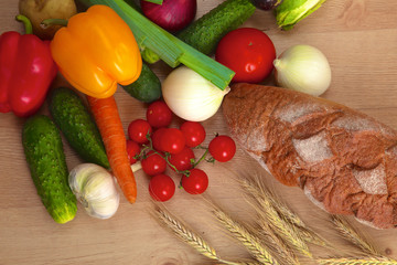 Pile of organic vegetables on a wooden table