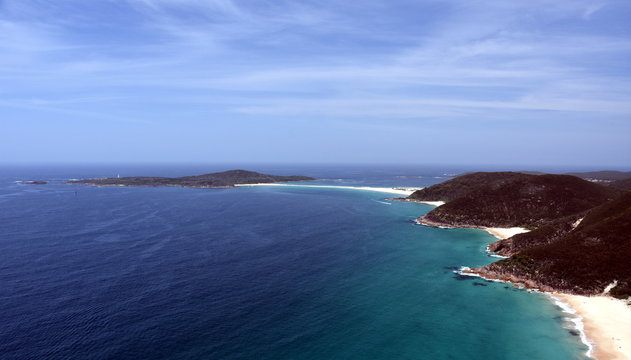 Shark Island and coastline of Shoal bay on a sunny day from Mount Tomaree Lookout (Central Coast, NSW, Australia)