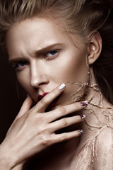 Obraz premium Beautiful girl with creative make-up art and design manicure. The beauty of the face. Photos shot in the studio.